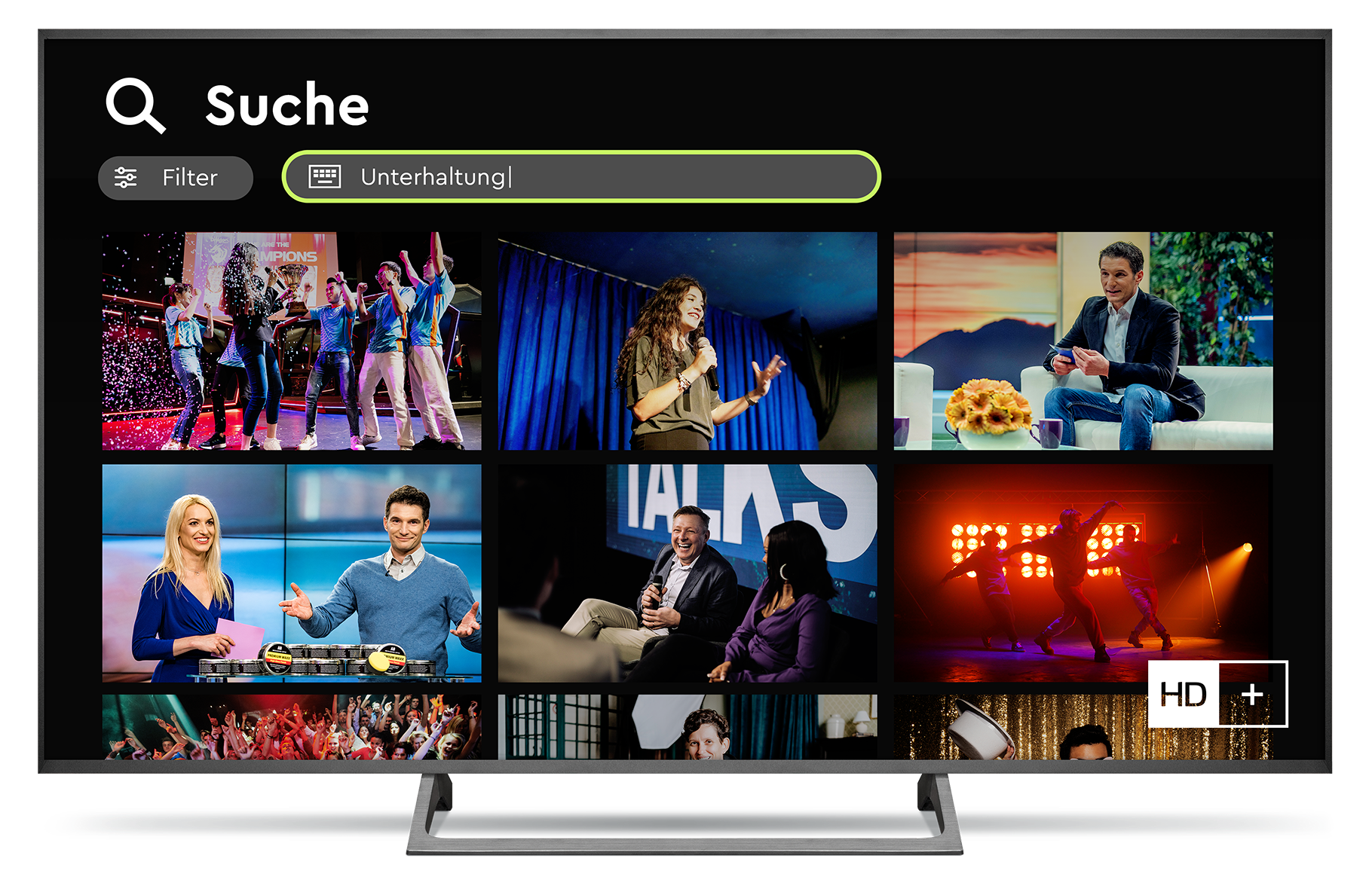 TV-Bildschirm zeigt eine Suche nach „Unterhaltung“ mit verschiedenen Vorschaubildern von Unterhaltungsshows, darunter Talkshows und Auftritte.