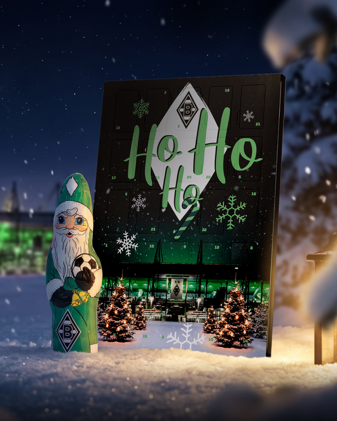 Snow-covered scene with a festive calendar displaying "Ho Ho Ho," a Santa figure holding a soccer ball, and a stadium backdrop with Christmas trees.