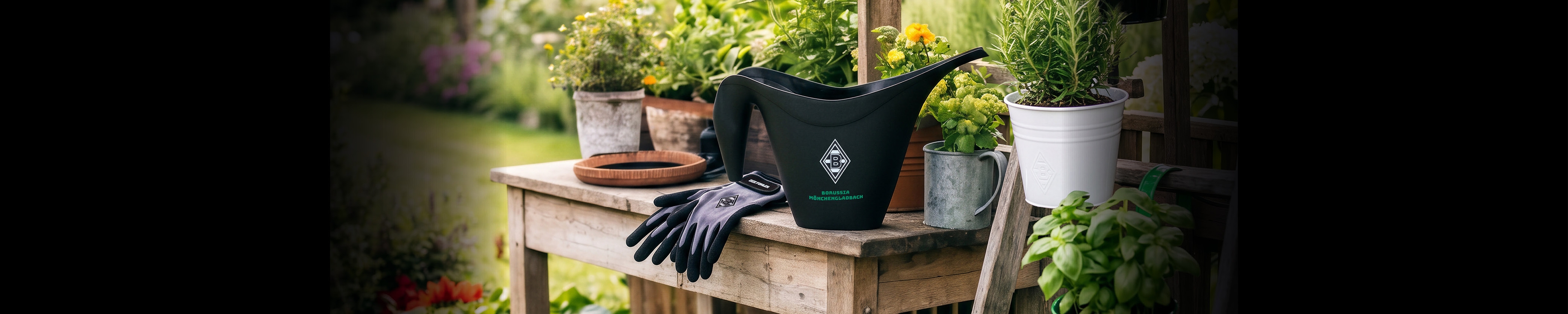 Gardening tools on a wooden bench with gloves, a black watering can, and potted plants in a lush garden setting.