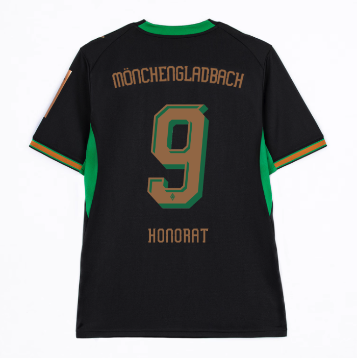 Back view of a black jersey with green details, featuring "Mönchengladbach," number 9, and "Honorat" printed on it.