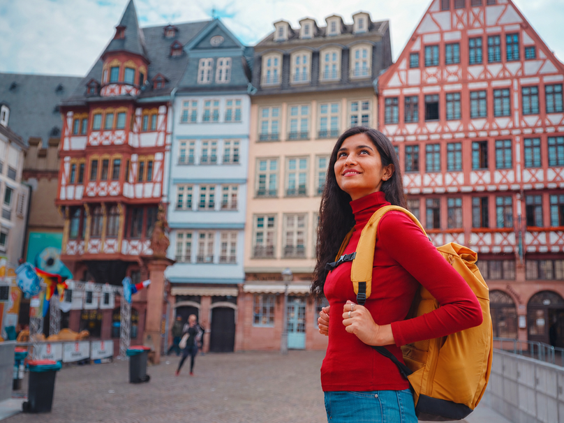 woman walks through old town of Frankfurt