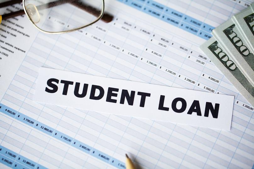 Student Loan Text on Financial Documents and Cash