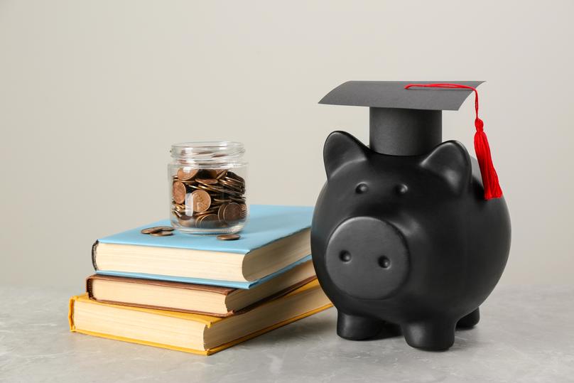 Graduation Piggy Bank with Books and Coins
