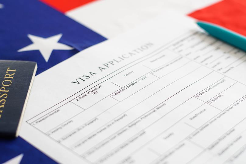 Visa Application with Flag and Pen
