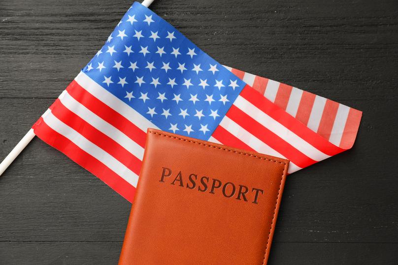 American Flag and Passport on a Black Background