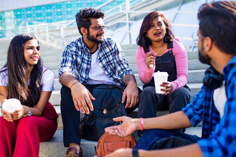 indian ethnicity friendship togetherness in park on sunny day