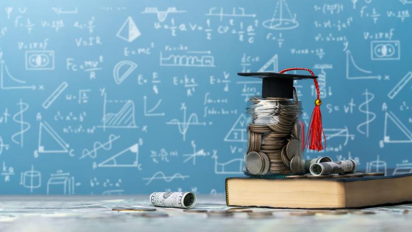 Savings for Education and Graduation Cap on Jar