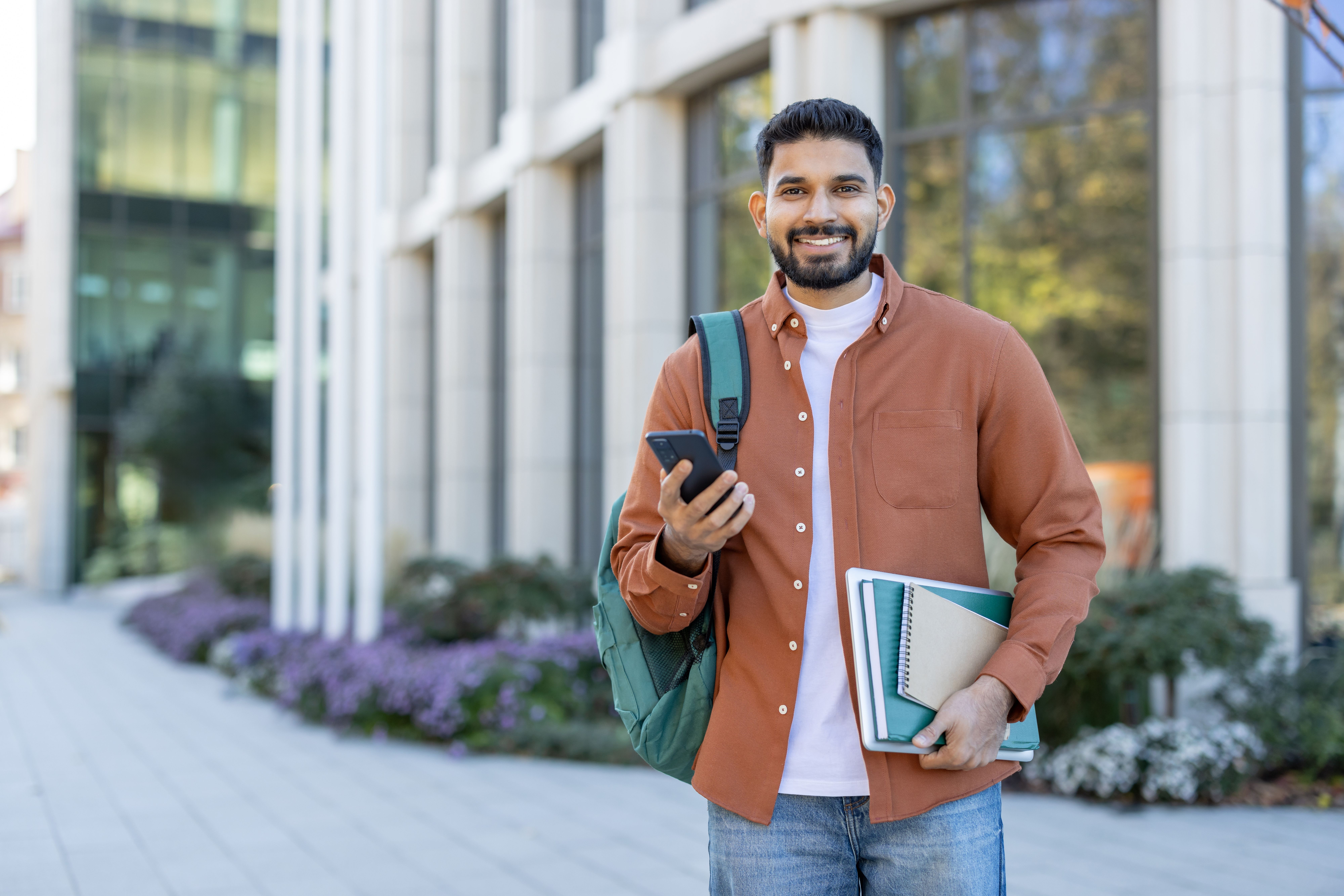 Student holding passport and laptop with caption “Study Abroad Loans Spring 2026 — Prodigy Finance”