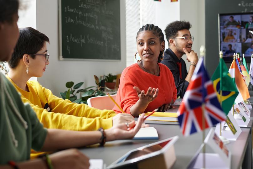 Multicultural Students Chatting in Class