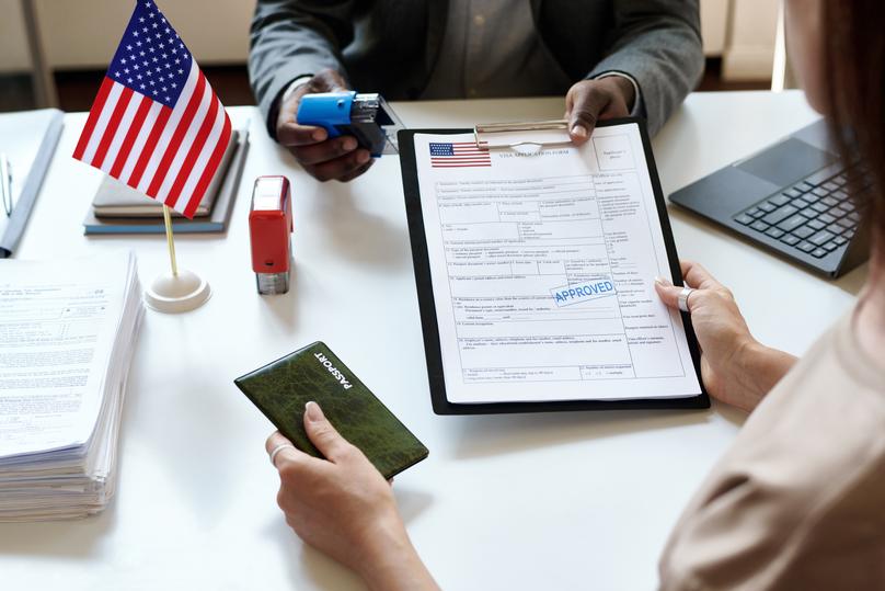 Visa Application Approved with Passport and US Flag