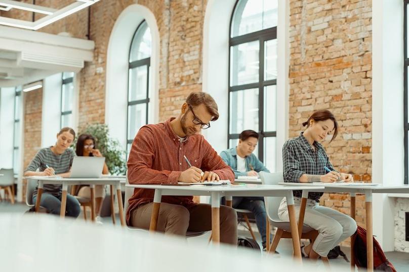 students are taking a test in classroom
