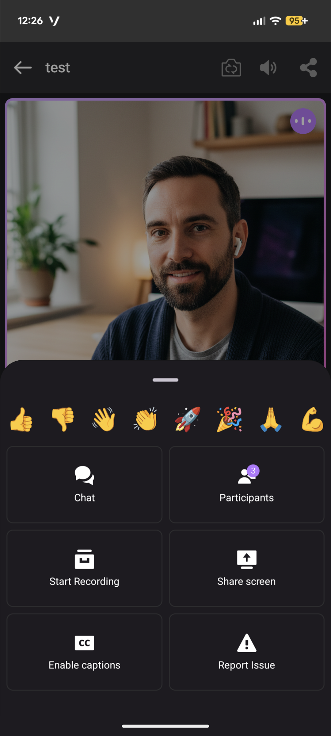 A person wearing earbuds during a video call on a smartphone app interface built with the Vonage Video API, with options like chat, share screen, and enable captions.