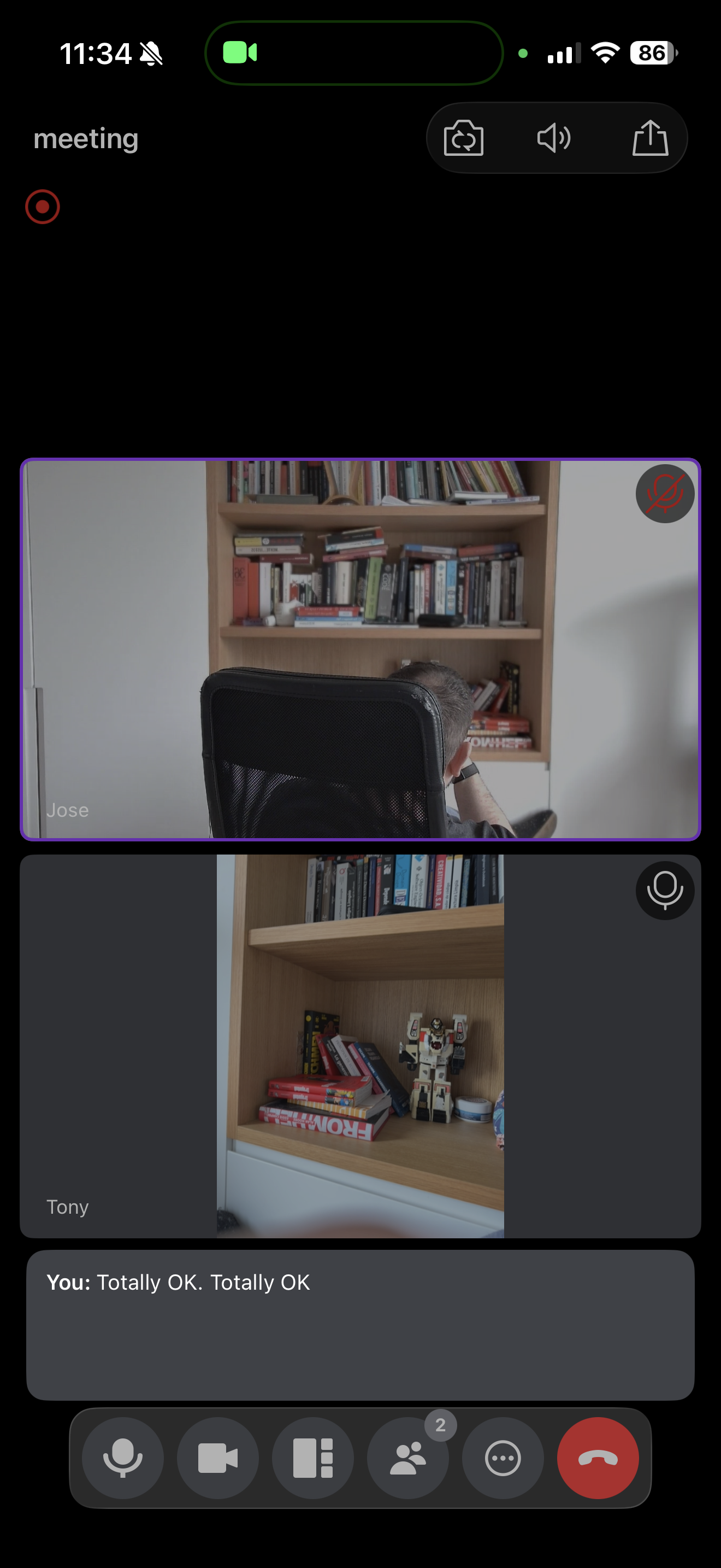 A video call screen showing two participants having a conversation with live captions turned on.