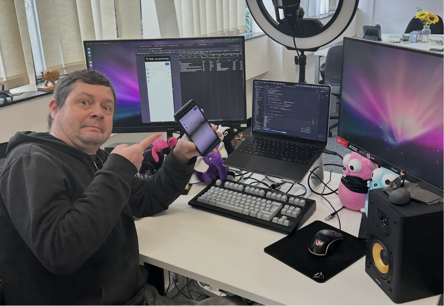 Me holding up a four-step NativePHP app