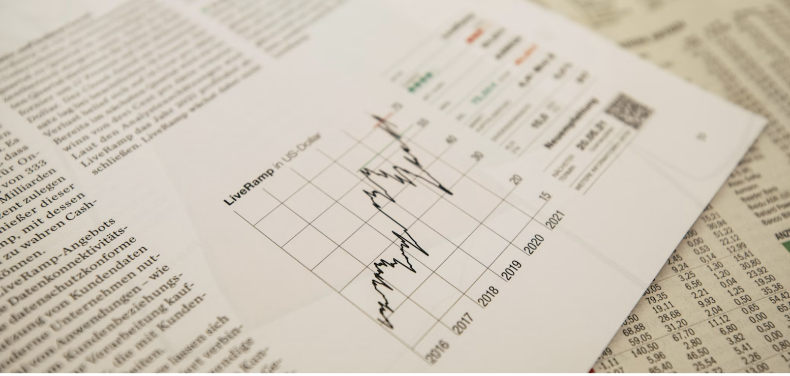 Photo of paperwork showing generic stock market press reporting