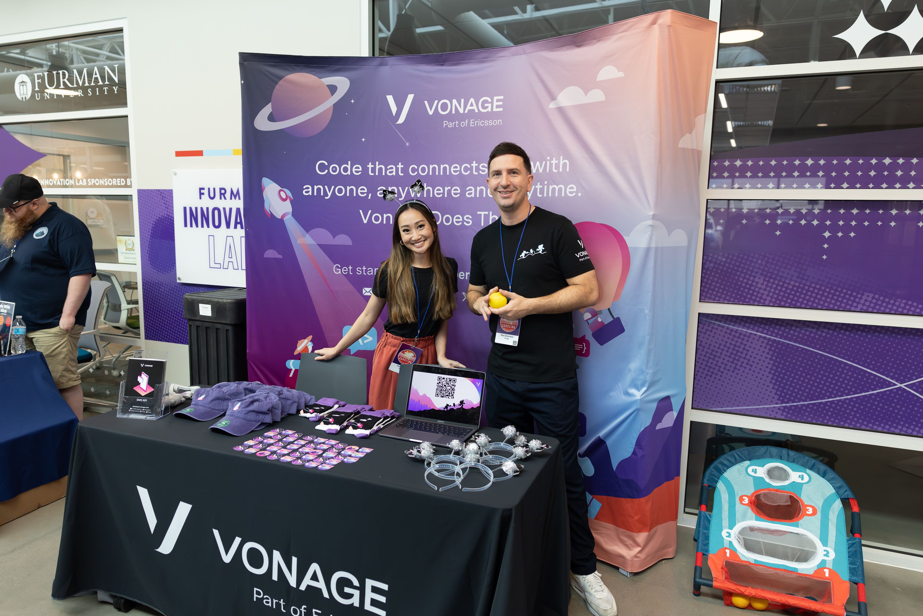 Max Chambers and Diana Pham standing at the Vonage booth at Carolina Codes