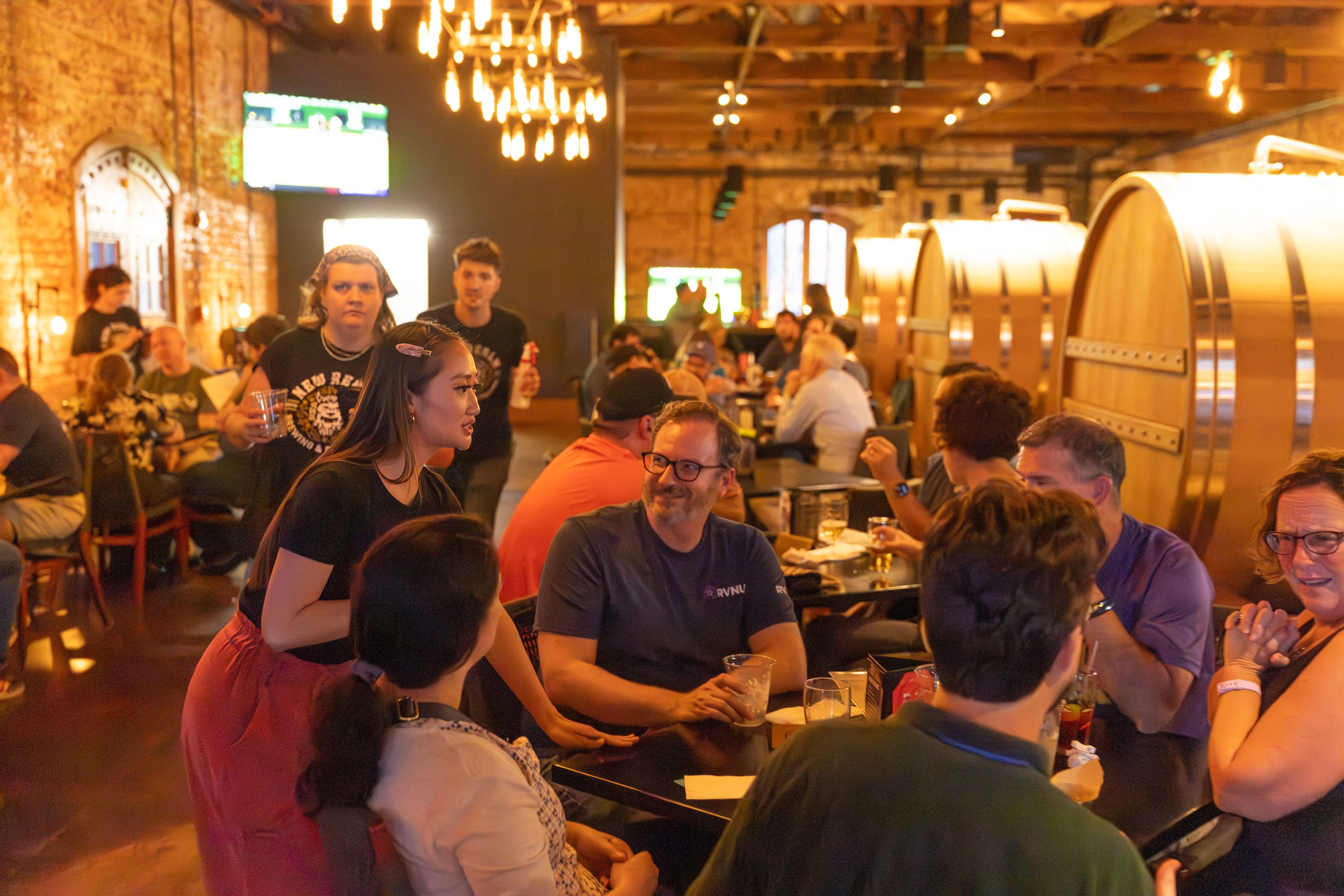 Diana Pham chatting with attendees during the Vonage happy hour at New Realm Brewery