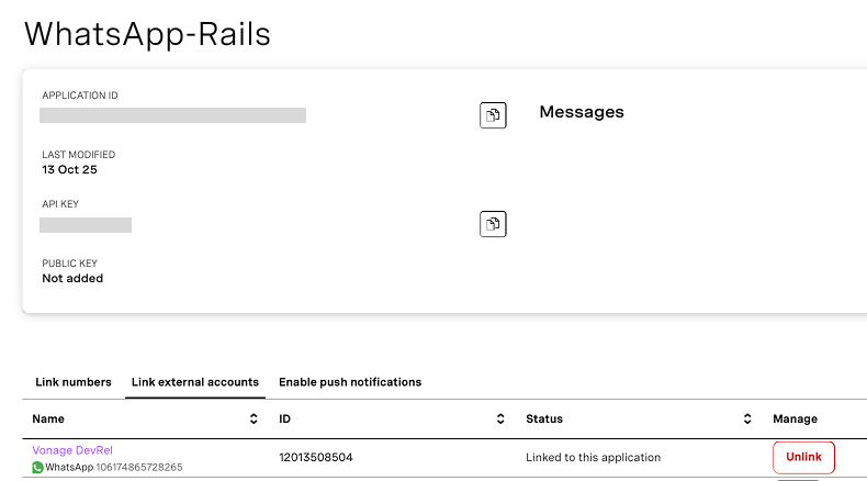 Screenshot of the Vonage Messages API dashboard showing the 'WhatsApp-Rails' application. It displays the Application ID, API Key, and status indicating the WhatsApp number 'Vonage DevRel' is linked with the application. A red 'Unlink' button is visible on the right.