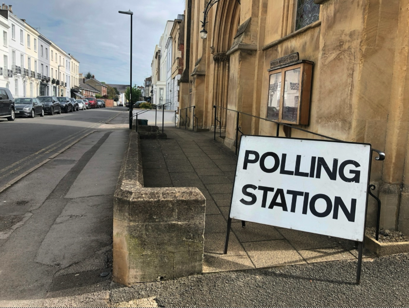 Photograph of a UK polling station sign on a street