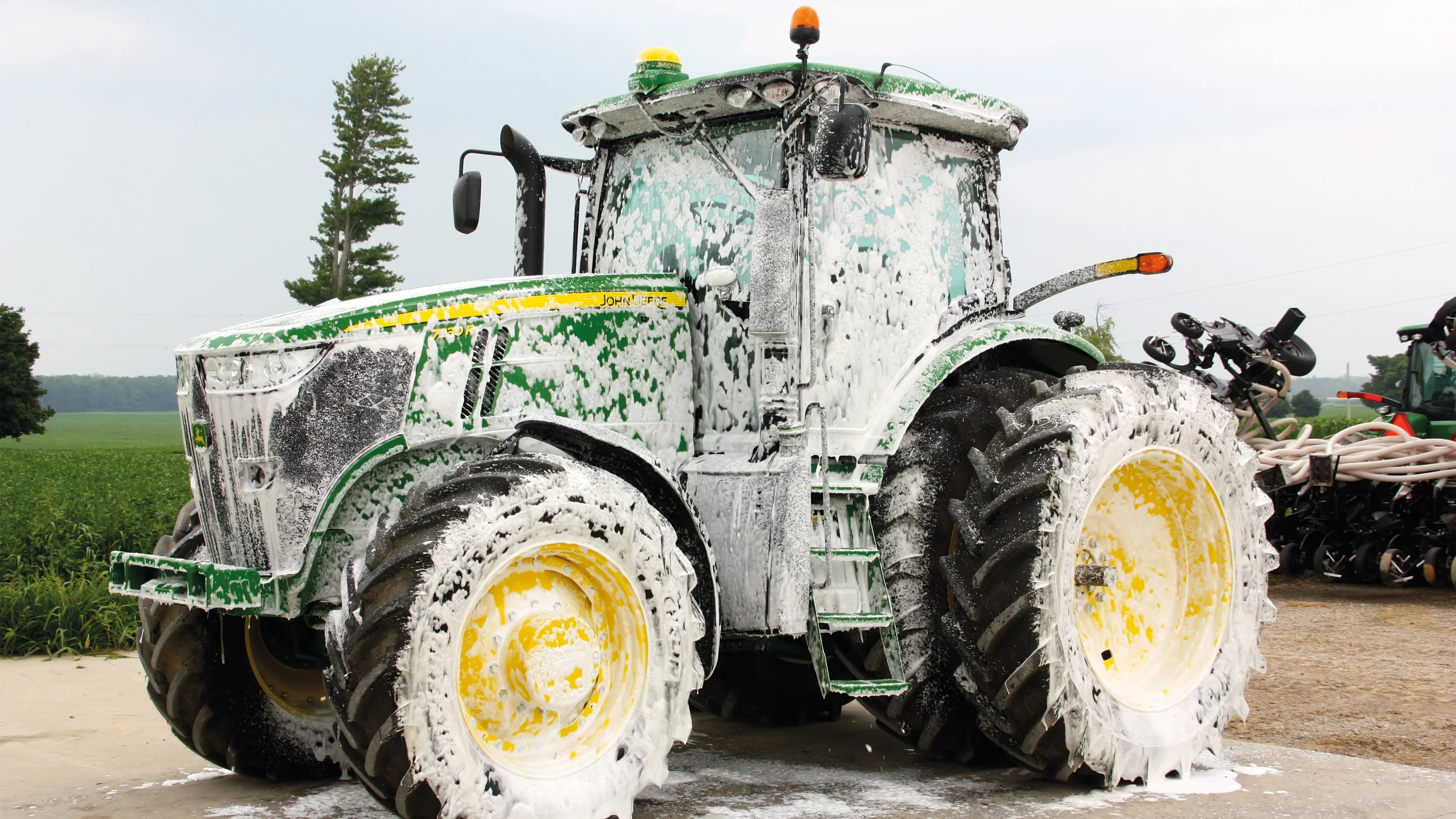 Tractor cleaning with soap and foam t&t cleaner vehicle