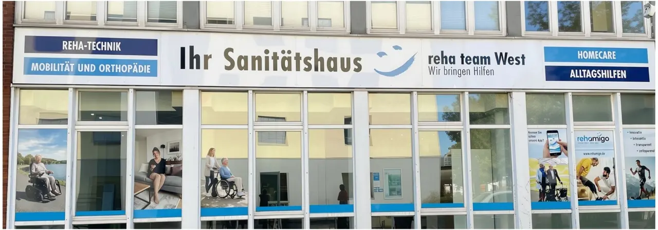 Storefront of a medical supply store "Ihr Sanitätshaus" with signage for mobility, orthopaedics, and homecare products, featuring window posters.