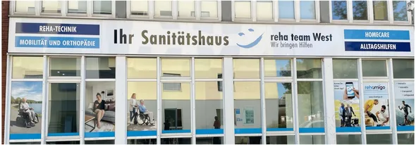 Storefront of a medical supply store "Ihr Sanitätshaus" with signage for mobility, orthopaedics, and homecare products, featuring window posters.