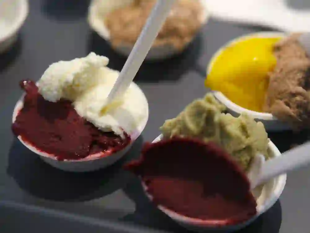 Various types of ice cream are offered in small bowls - the intense colours and textures create an immediate appetite and anticipation of a sweet taste experience.