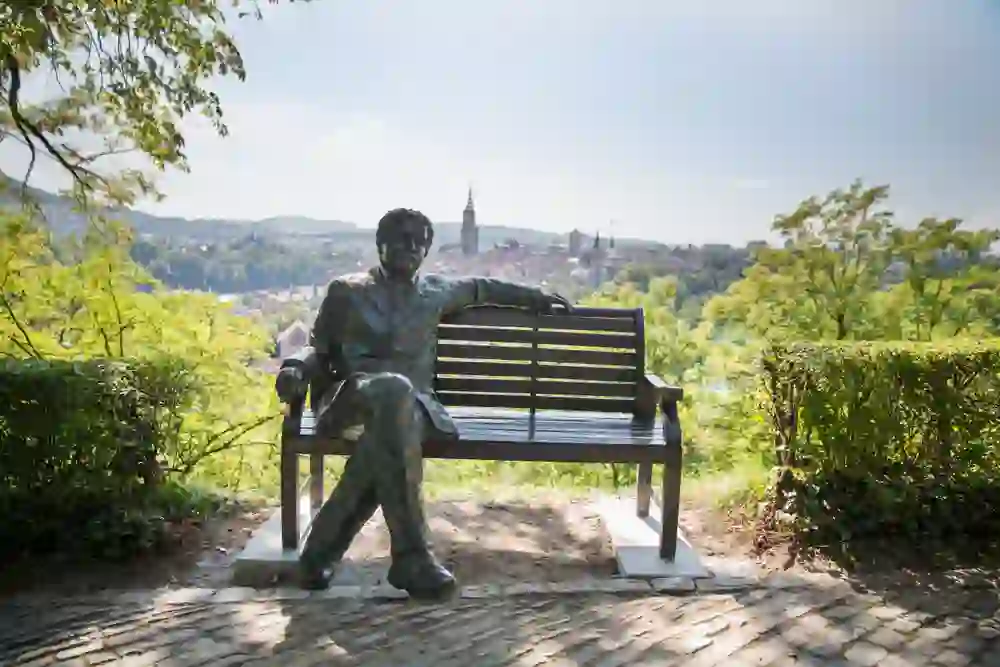 The photo shows an exhibition room with documents and a suit that conveys an intellectual and historical atmosphere.