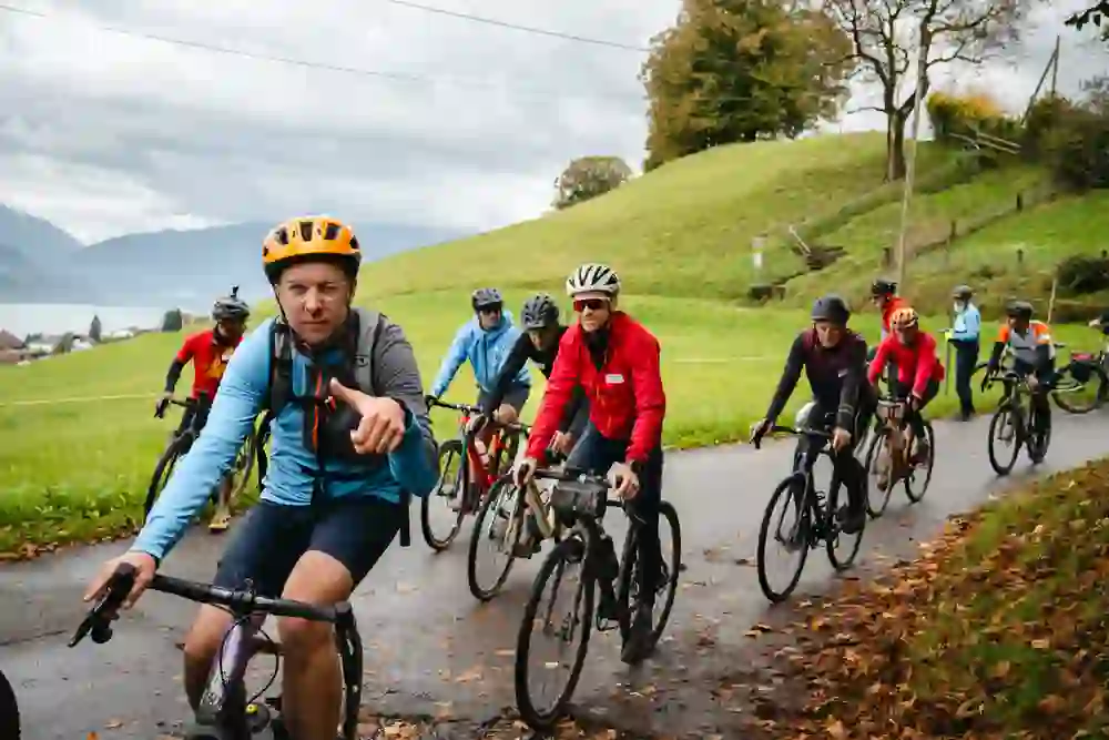 The picture shows cyclists at the Cycle Summit. The rider in front gives a thumbs up.