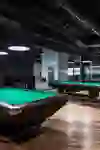 Fine wood, subdued lighting and perfectly aligned billiard tables create a calm, focussed atmosphere - ideal for relaxed game evenings and precise shots in a modern ambience.