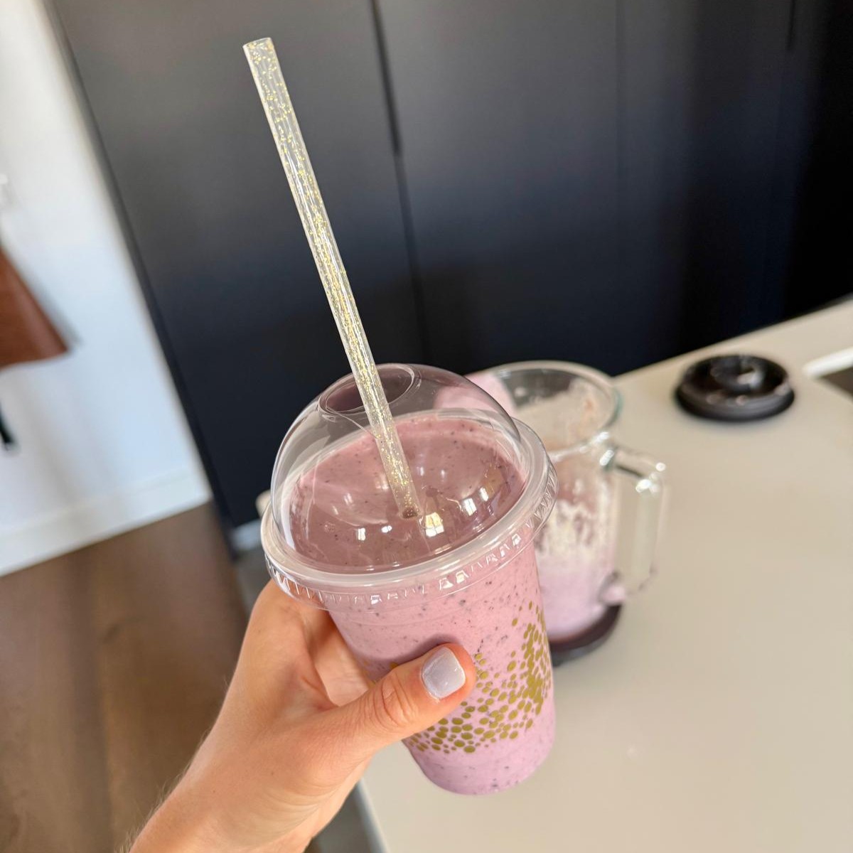 High-protein gestational diabetes breakfast photo of a blueberry cheesecake smoothie in a clear cup with a straw.