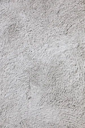 Surface detail of grey StoSignature render in its freeform brushed pattern