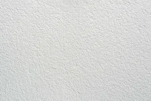 Putz Fassade Putzoberfläche Oberfläche Detail Vollabrieb Kratzputz Scheibenputz 1.5mm Körnung StoColor Sto Architectural Colours Farbton naturweiss matt rau grob