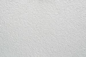 Putz Fassade Putzoberfläche Oberfläche Detail Vollabrieb Kratzputz Scheibenputz 1.5mm Körnung StoColor Sto Architectural Colours Farbton naturweiss matt rau grob