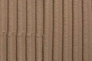 Material: plaster facade surface detail combed render ?mm grain StoColor Sto Architectural Colours Colour shade 16066 matt rough grooved rilled directional linear