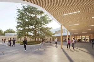 Innenhof eines Schulneubaus mit Schülern, in der Mitte eine Zeder