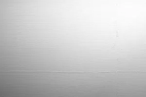 Putz Fassade Putzoberfläche Oberfläche Detail Stempelputz eingedrückt gestempelt Abdruck Körnung StoColor Sto Architectural Colours Farbton naturweiss matt grafisch gemustert gerastert