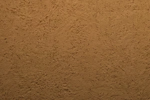 Material: Putz Fassade Putzoberfläche Oberfläche Detail Kellenschlagputz Kellendruckputz Altdeutscherputz Klosterputz verwaschen Körnung StoColor Sto Architectural Colours Farbton Y12 52 39 Terra di Siena matt rau grob rustikal verwaschen