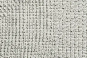 Material: Putz Fassade Putzoberfläche Oberfläche Detail Stempelputz eingedrückt gestempelt Abdruck gekämmt Körnung StoColor Sto Architectural Colours Farbton Y03 93 02 matt grafisch gemustert gerastert
