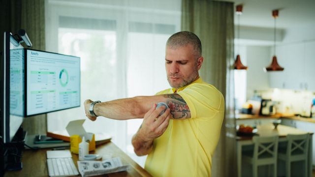 man checking diabetes levels