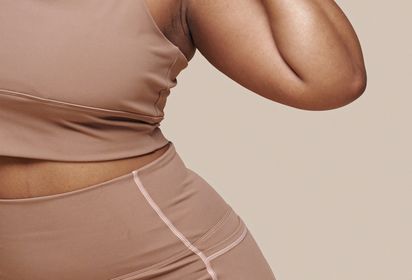 Woman stretching in sports gear