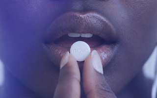 woman taking pill