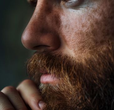man stroking beard