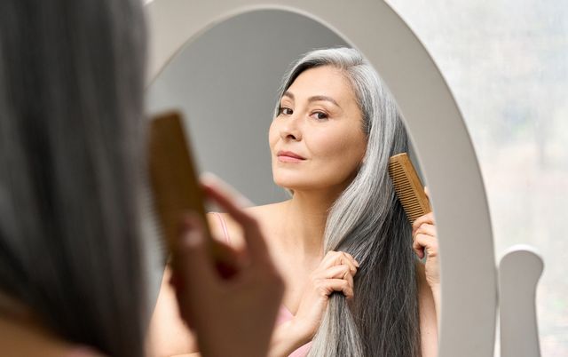 woman menopause doing her hair