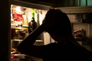 man in fridge at night
