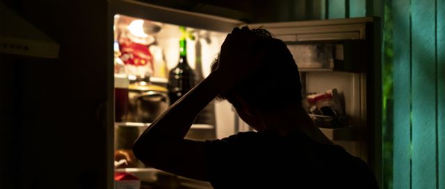 man in fridge at night