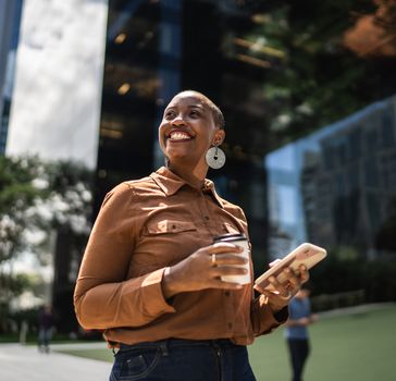 woman happy walking to work with coffee