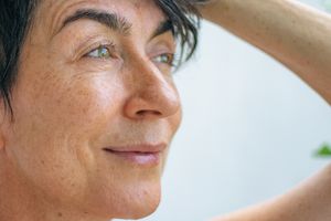 woman-touching-her-hair woman-touching-her-hair