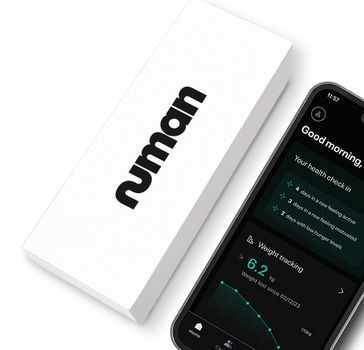 A Numan package next to a smartphone showing the home screen of the  Numan app