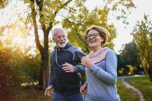 healthy older couple running